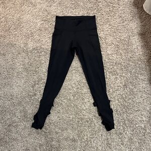 Athleta women XS Black Leggings with cross on the back - partially open calf